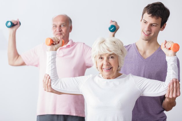 Personal trainer and elderly couple