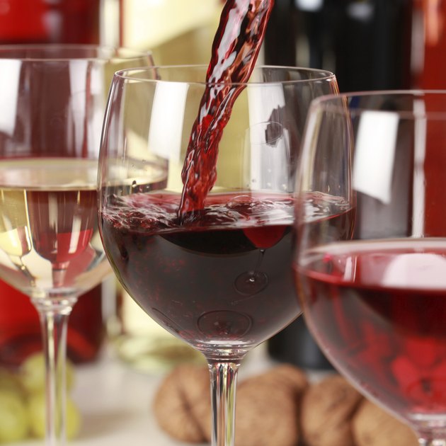 Red wine pouring into a glass