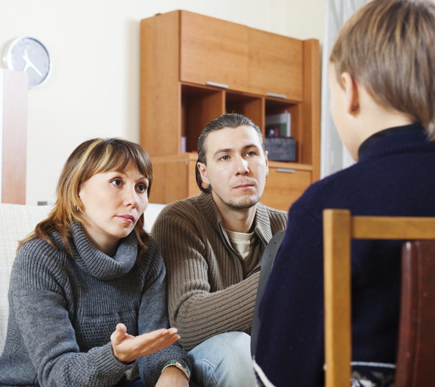Parents scolding teenager