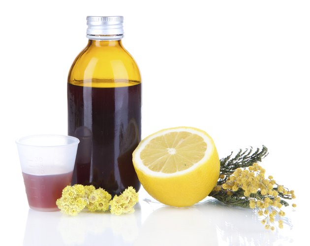 Cough syrup isolated on white