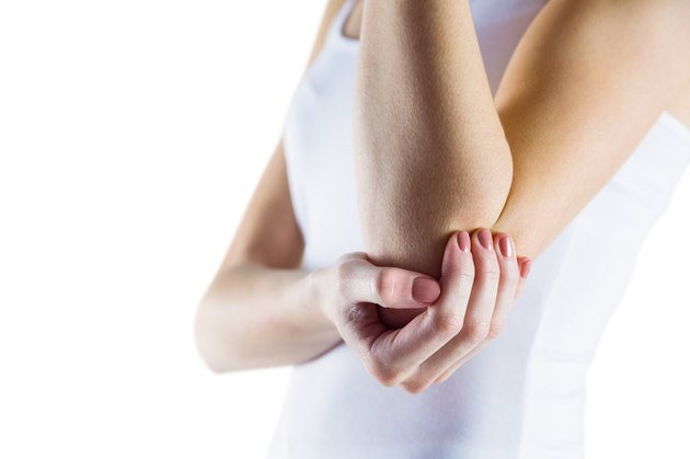 Fit woman with elbow injury