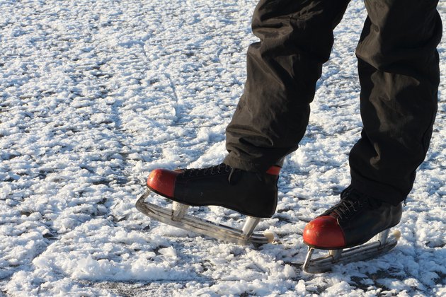 Male feet in the skates on a snow surface