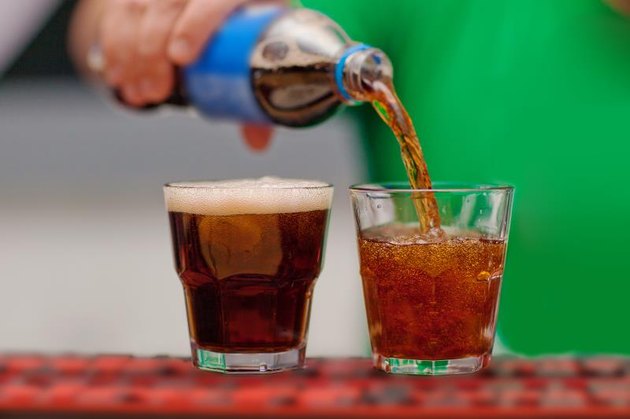 Carbonated drink poured into a glass.