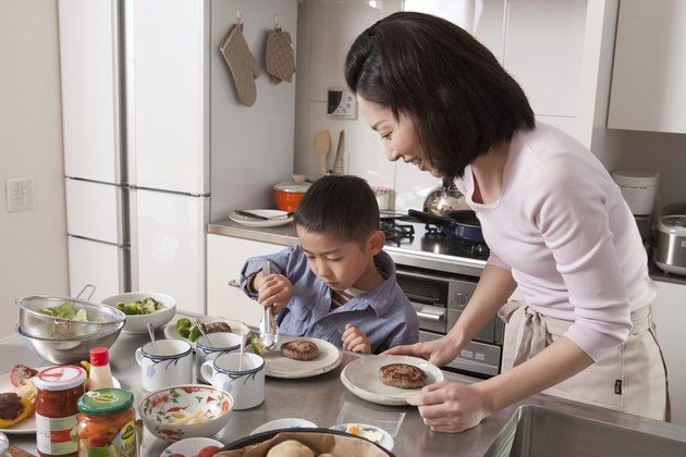 Boy Arranging Dishes on Plate