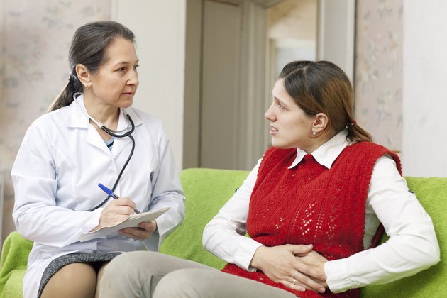 woman complaining of pain in his side