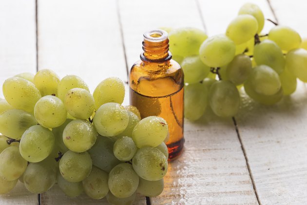 Fresh grape and seed oil in bottle