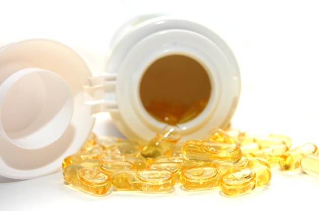 pot of yellow round pills - vitamin d