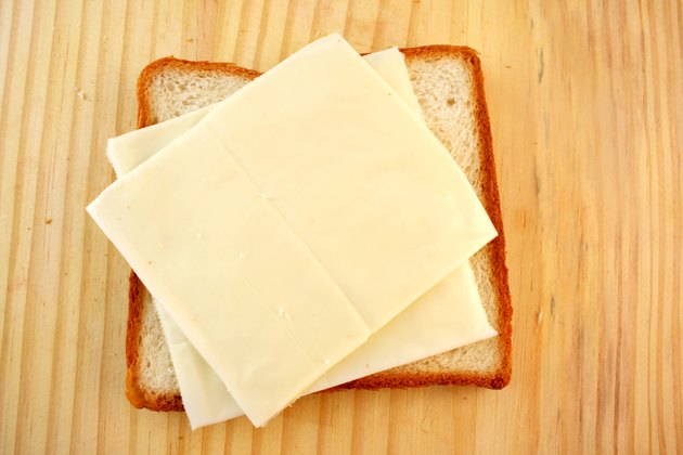 Slices of cheese on a piece of bread