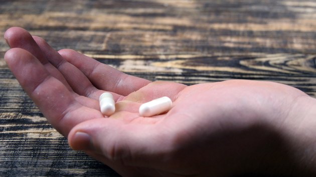 Medical Capsules On A Palm Of Hand