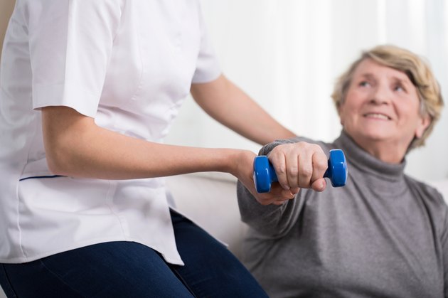 Woman and physiotherapist's help
