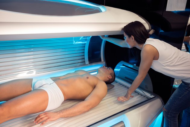 girl employee in a solarium with customer