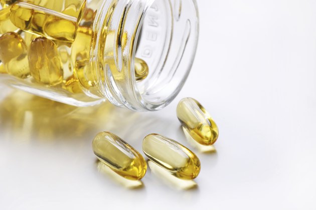 Fish oil spilling from bottle