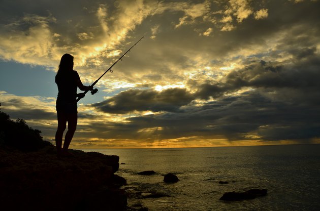 Fishing while standing on a cliff in Hawaii