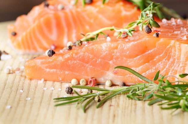 Raw salmon on cutting board