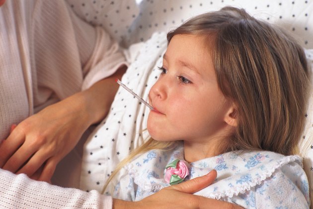 Mother comforting sick daughter