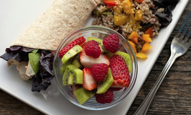 Healthy lunch chicken wrap with fruit and wild rice