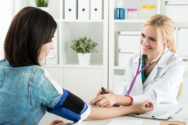 Medicine doctor measuring blood pressure to patient