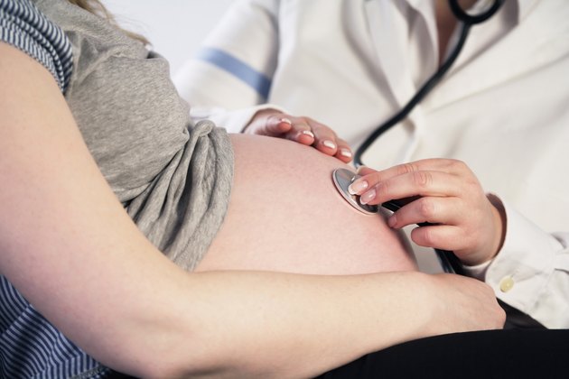 Doctor examining a pregnant woman