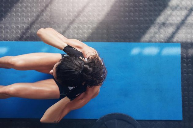 How to Do Sit-Ups Without Anchoring Your Feet