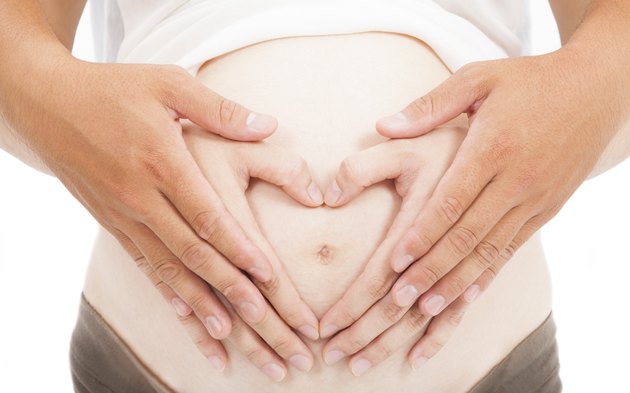 love hand of pregnant woman and her husband