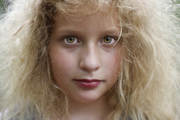 Girl (8-9) with make-up, smiling, portrait, close-up
