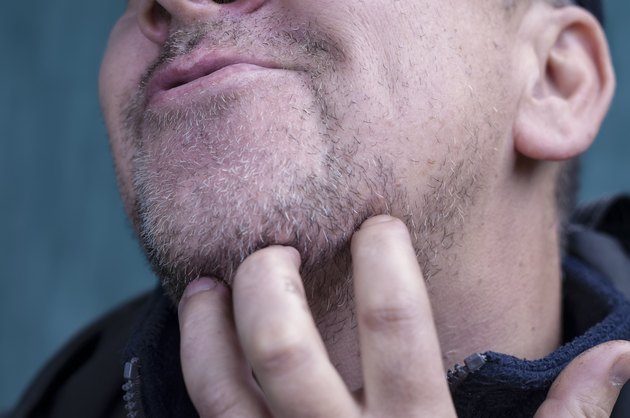 Man Scratching Beard