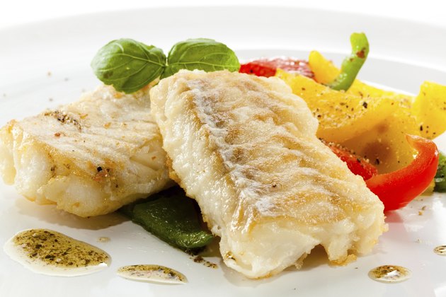 Fried cod fillets and vegetables