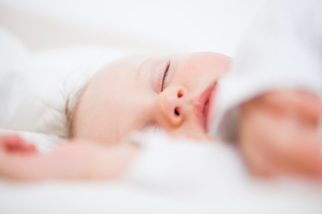 Baby falling asleep while extending her arms