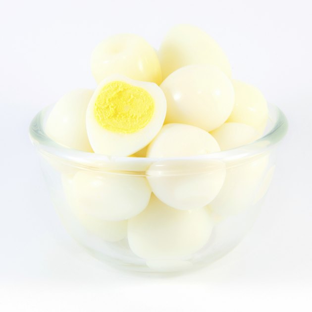Boiled quail eggs on white background