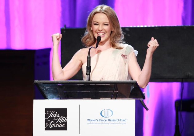 BEVERLY HILLS, CA - MAY 02: Singer Kylie Minogue accepts the 2013 Courage Award onstage during EIF Womens Cancer Research Funds 16th Annual An Unforgettable Evening presented by Saks Fifth Avenue at the Beverly Wilshire Four Seasons Hotel on May 2, 2013 in Beverly Hills, California. (Photo by Joe Scarnici/Getty Images for EIF)