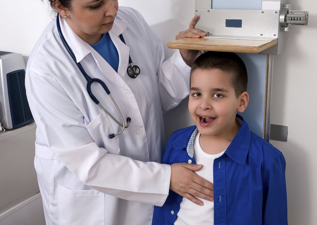 Doctor Measuring Height