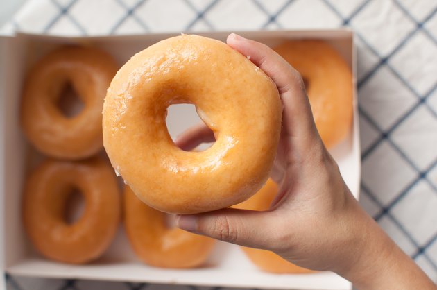 Hand picking donuts