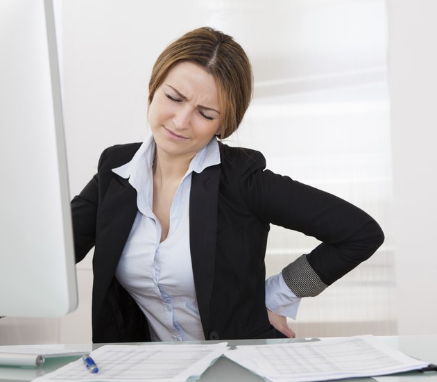 Businesswoman With Back Pain