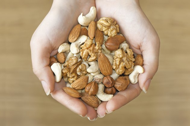 Various nuts in hands