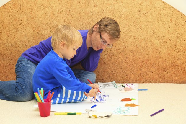 father and son drawing together