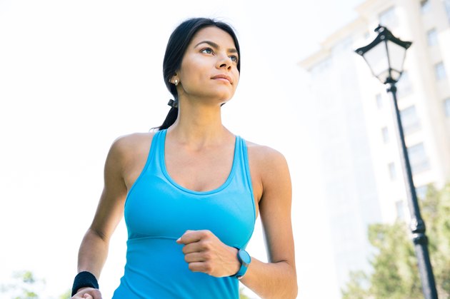 Sports woman running outdoors
