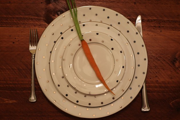 Food: empty plate setting with carrot