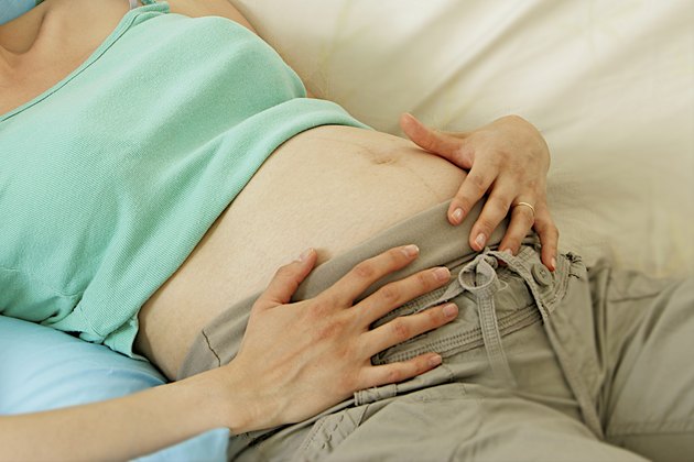 pregnant woman having belly pain