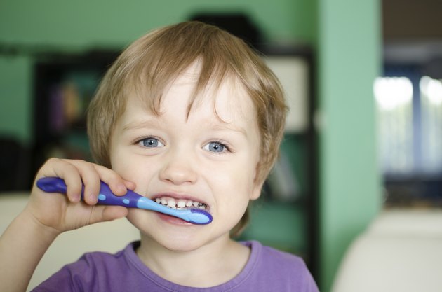 Little boy brushing teeth