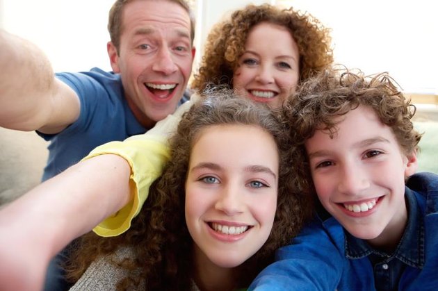 Happy family with teenage children.
