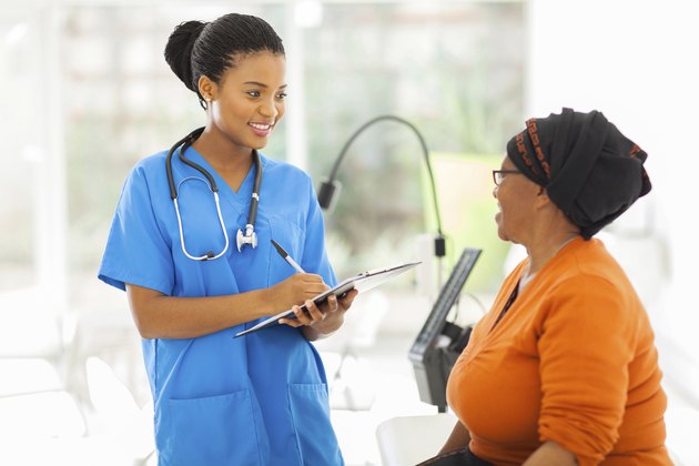 african medical nurse and senior patient