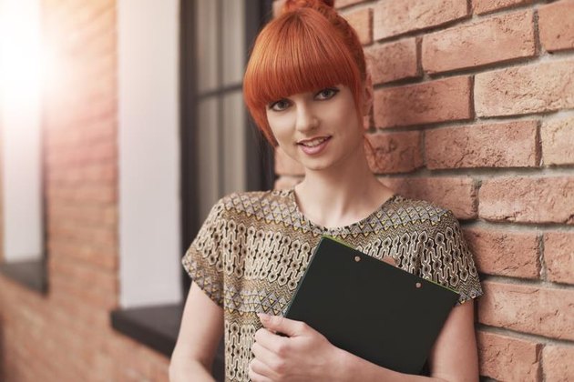 Portrait of young and stylish business woman