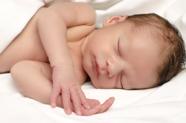 Beautiful innocent newborn sleeping.