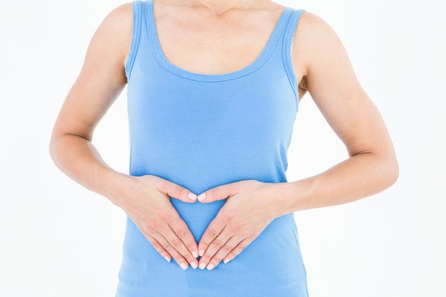 Woman touching her painful stomach