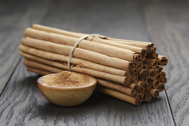 bunch of cinnamon sticks tied with twine and powder