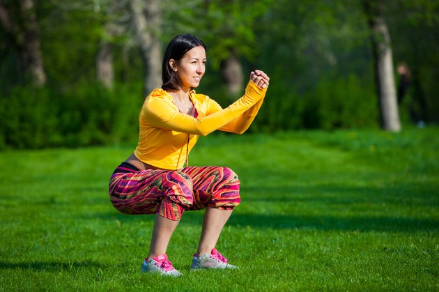 sport and lifestyle concept - woman doing sports outdoors