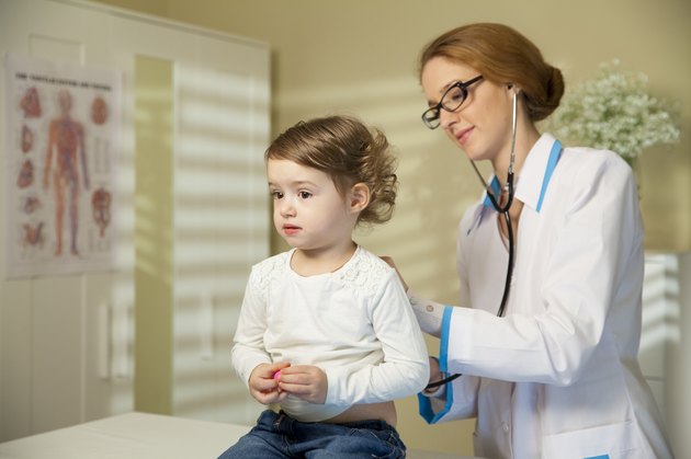 Cute little girl and doctor