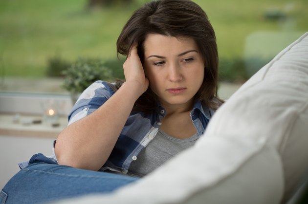 Teenage girl having headache