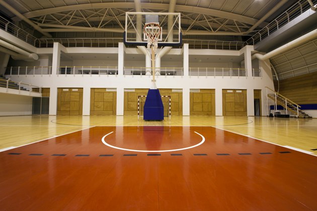 Below the basket on a gymnasium