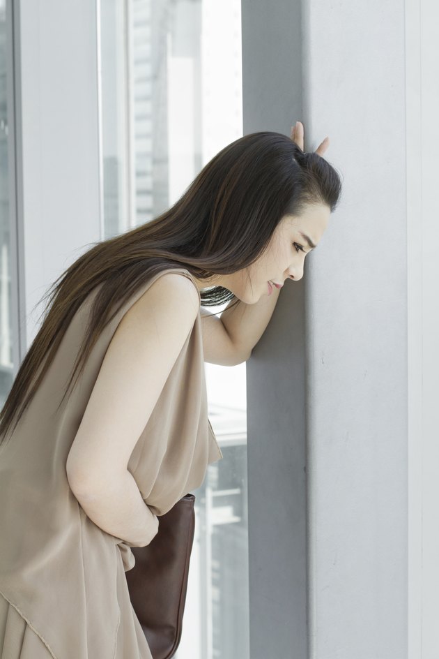 woman with menstruation pain, stomach ache, digestive problem